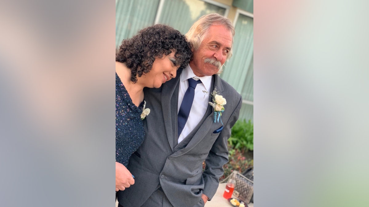 A couple posing for a picture